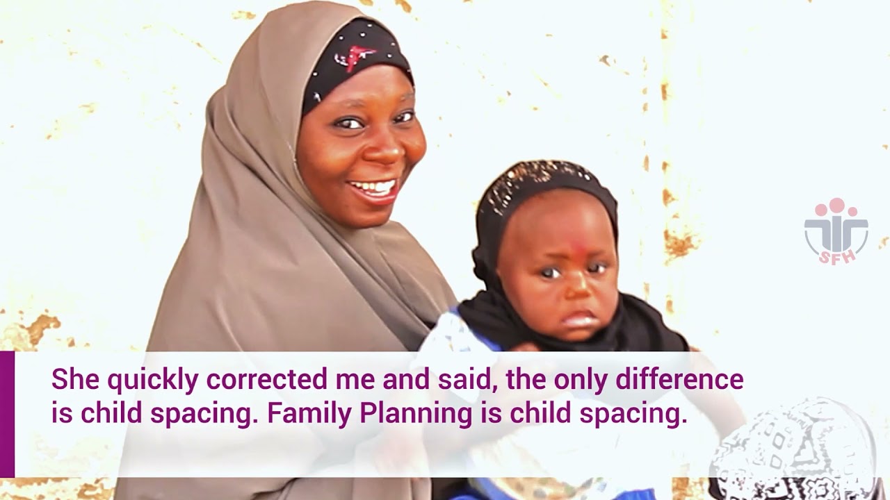 A young mother from Amaru community in Zaria, Kaduna State, holding her child during an IntegratE interview on family planning